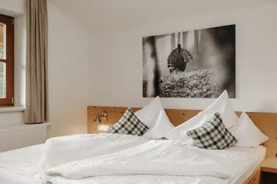 Ein Bett oder Betten in einem Zimmer der Unterkunft Hubertus - Das Landhaus