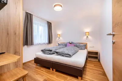 Ein Bett oder Betten in einem Zimmer der Unterkunft d'Hoamatliab