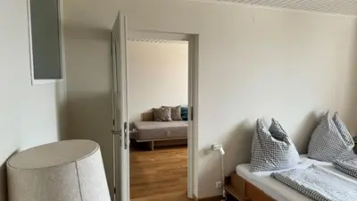 Ein Bett oder Betten in einem Zimmer der Unterkunft Pension Hanslmann