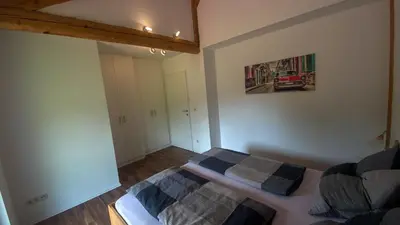 Ein Bett oder Betten in einem Zimmer der Unterkunft Ferienwohnung Scheierlweg
