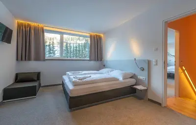 Ein Bett oder Betten in einem Zimmer der Unterkunft Riverside Residence Flachau