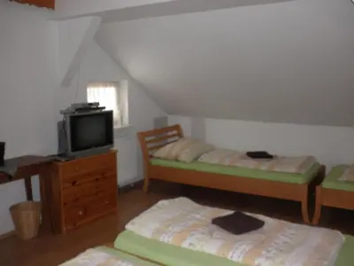 Ein Bett oder Betten in einem Zimmer der Unterkunft Alpenpension