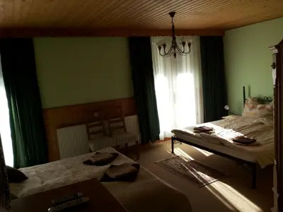 Ein Bett oder Betten in einem Zimmer der Unterkunft Alpenpension