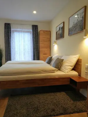 Ein Bett oder Betten in einem Zimmer der Unterkunft Gästehaus Moser