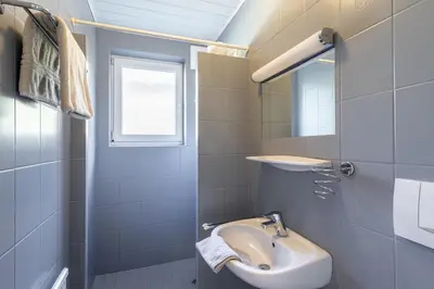 Ein Badezimmer in der Unterkunft Appartements DAS RETTENBACHER