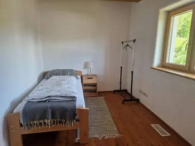 Ein Bett oder Betten in einem Zimmer der Unterkunft Wohnung mit Garten