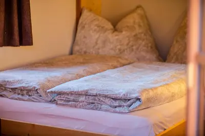 Ein Bett oder Betten in einem Zimmer der Unterkunft Troadkasten Chalet Unterkoller