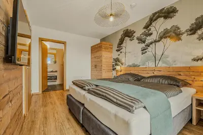 Ein Bett oder Betten in einem Zimmer der Unterkunft Ski-In&Out auf 1641m, Sauna, Tiefgarage