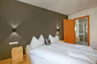 Ein Bett oder Betten in einem Zimmer der Unterkunft Panorama Chalet Grau