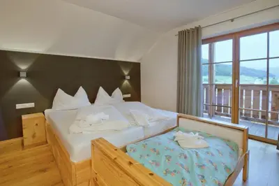 Ein Bett oder Betten in einem Zimmer der Unterkunft Panorama Chalet Grau