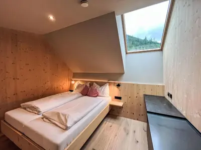 Ein Bett oder Betten in einem Zimmer der Unterkunft Apartment Hideaway Planneralm by Jufa Hotels-3 by Interhome