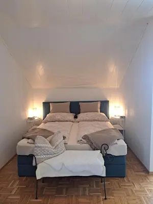 Ein Bett oder Betten in einem Zimmer der Unterkunft Ferienwohnung Bergblick