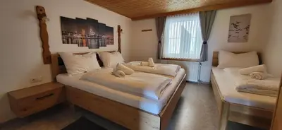 Ein Bett oder Betten in einem Zimmer der Unterkunft SFischbacher App 2 by Alpenidyll Apartments