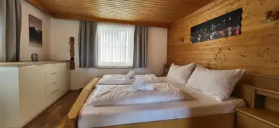 Ein Bett oder Betten in einem Zimmer der Unterkunft SFischbacher App 2 by Alpenidyll Apartments