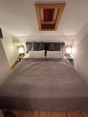 Ein Bett oder Betten in einem Zimmer der Unterkunft Nannerls Penthouse