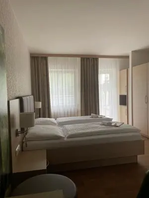 Ein Bett oder Betten in einem Zimmer der Unterkunft OptimaMed Gesundheitsresort Bad Wimsbach