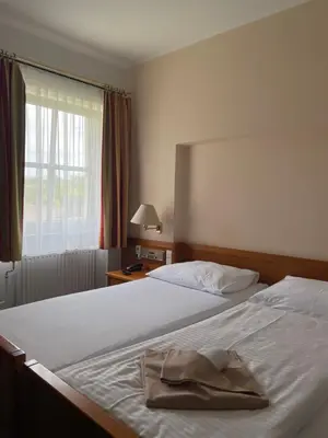 Ein Bett oder Betten in einem Zimmer der Unterkunft OptimaMed Gesundheitsresort Bad Wimsbach