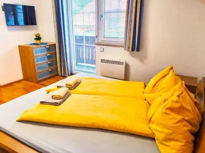 Ein Bett oder Betten in einem Zimmer der Unterkunft Chalet Astrid by Interhome