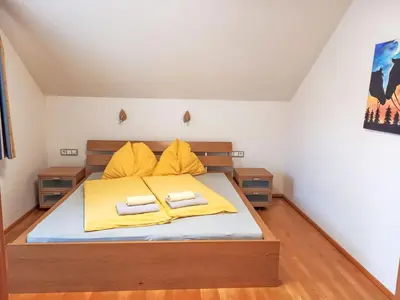 Ein Bett oder Betten in einem Zimmer der Unterkunft Chalet Astrid by Interhome