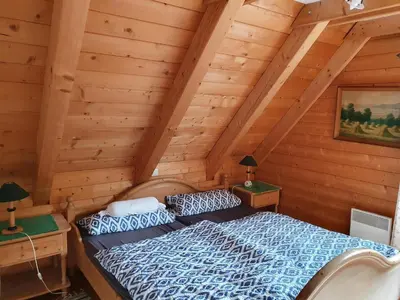 Ein Bett oder Betten in einem Zimmer der Unterkunft Ferienhaus Müller-Kräuter
