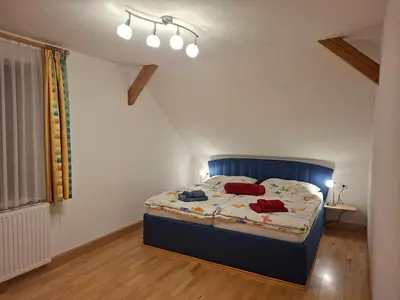 Ein Bett oder Betten in einem Zimmer der Unterkunft Ferienwohnungen Viktoria Buchegger