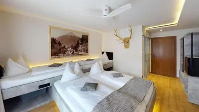 Ein Bett oder Betten in einem Zimmer der Unterkunft Boutique Hotel Adler