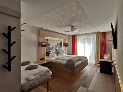 Ein Bett oder Betten in einem Zimmer der Unterkunft Boutique Hotel Adler