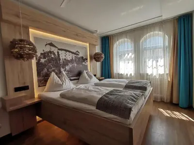 Ein Bett oder Betten in einem Zimmer der Unterkunft Boutique Hotel Adler