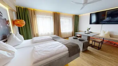 Ein Bett oder Betten in einem Zimmer der Unterkunft Boutique Hotel Adler