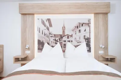 Ein Bett oder Betten in einem Zimmer der Unterkunft Boutique Hotel Adler