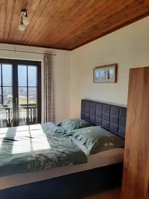 Ein Bett oder Betten in einem Zimmer der Unterkunft Apartment - Am Buchenhof