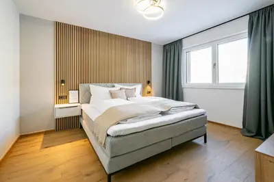 Ein Bett oder Betten in einem Zimmer der Unterkunft Kirchner's Apartments