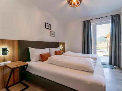 Ein Bett oder Betten in einem Zimmer der Unterkunft Grebenzen Lodge 53