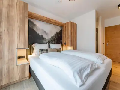 Ein Bett oder Betten in einem Zimmer der Unterkunft Grebenzen Lodge 44