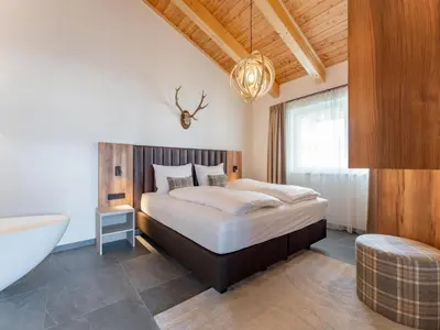 Ein Bett oder Betten in einem Zimmer der Unterkunft Grebenzen Lodge 44