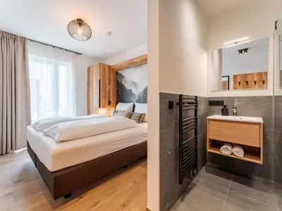 Ein Bett oder Betten in einem Zimmer der Unterkunft Grebenzen Lodge 44