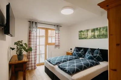 Ein Bett oder Betten in einem Zimmer der Unterkunft Rainerhof Troadkasten