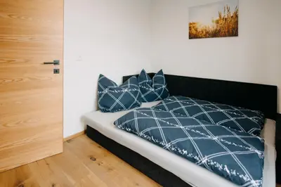 Ein Bett oder Betten in einem Zimmer der Unterkunft Rainerhof Troadkasten