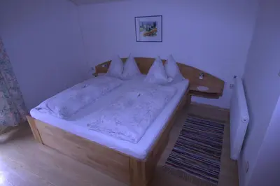 Ein Bett oder Betten in einem Zimmer der Unterkunft Hausmenneweger