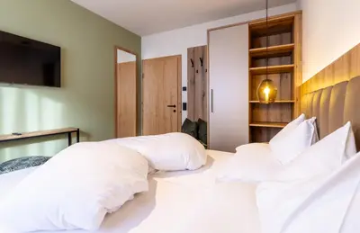 Ein Bett oder Betten in einem Zimmer der Unterkunft Höflehner Premium Gumpen Lodge
