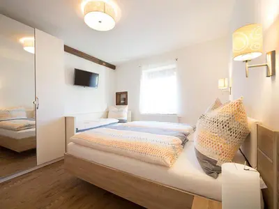 Ein Bett oder Betten in einem Zimmer der Unterkunft Apartments Altstadtflair