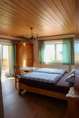 Ein Bett oder Betten in einem Zimmer der Unterkunft Ferienwohnung Trisselwand
