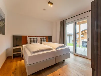 Ein Bett oder Betten in einem Zimmer der Unterkunft Grebenzen Lodge Starnberg 60B