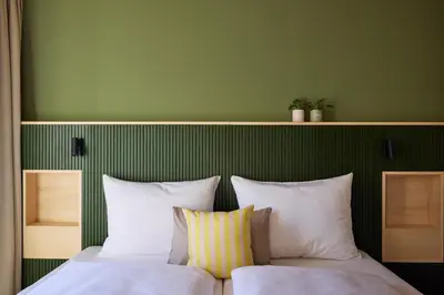 Ein Bett oder Betten in einem Zimmer der Unterkunft Hotel UND - smart alpine stay