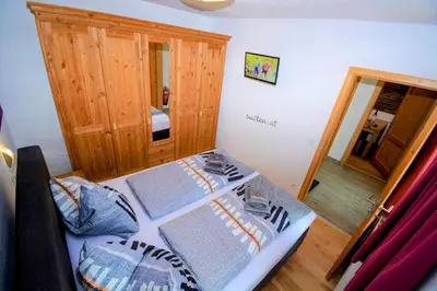 Ein Bett oder Betten in einem Zimmer der Unterkunft David Appartments
