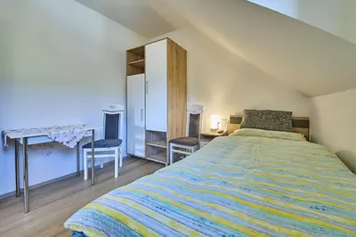 Ein Bett oder Betten in einem Zimmer der Unterkunft Krapflhof