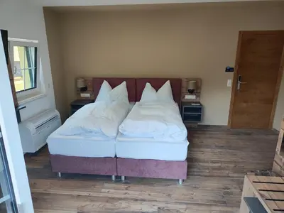 Ein Bett oder Betten in einem Zimmer der Unterkunft Hotel-Bad Goisern