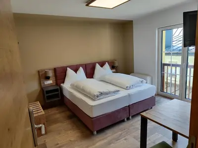 Ein Bett oder Betten in einem Zimmer der Unterkunft Hotel-Bad Goisern