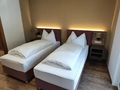 Ein Bett oder Betten in einem Zimmer der Unterkunft Hotel-Bad Goisern