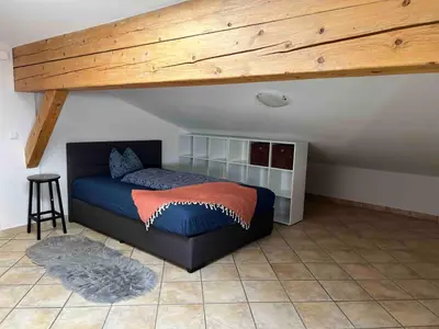 Ein Bett oder Betten in einem Zimmer der Unterkunft Tauglerei Appartement Hagebutte